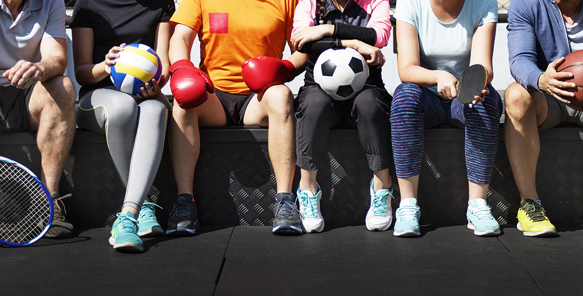 Group of diverse athletes sitting together