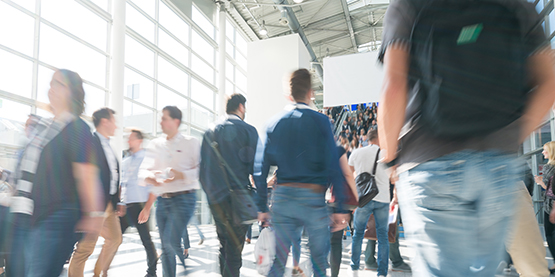 blurred business people at a trade fair