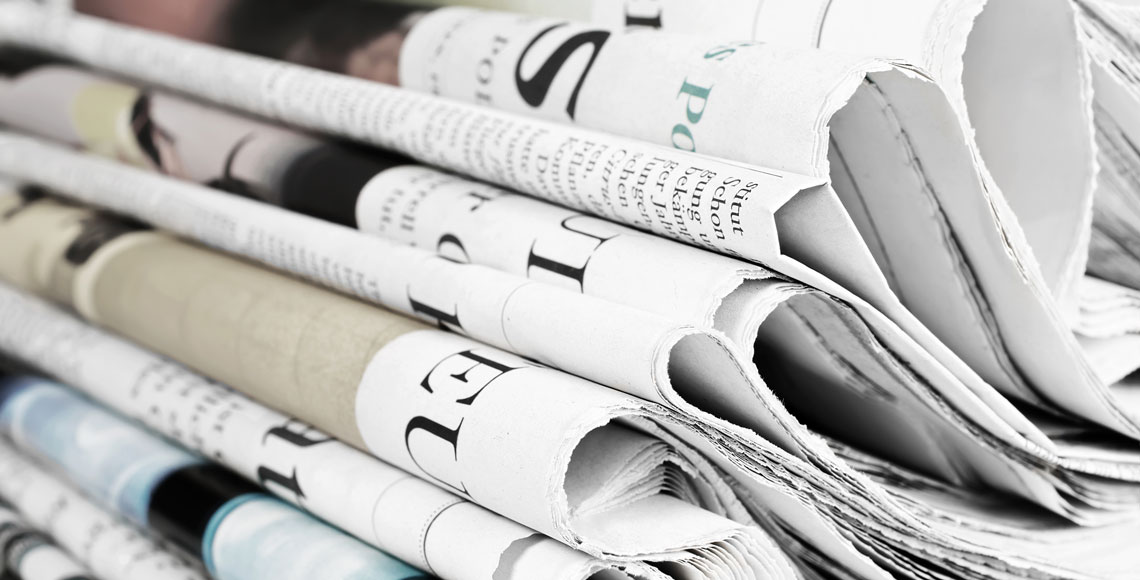 Pile of old newspapers, selective focus