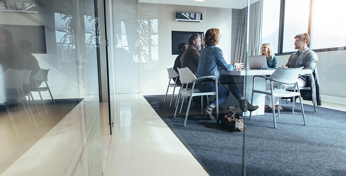 Group of business people having discussion in conference room